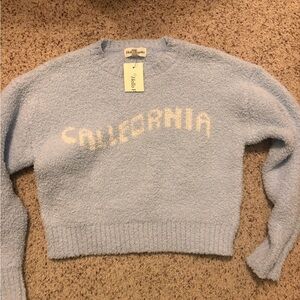 Blue girl’s sweater